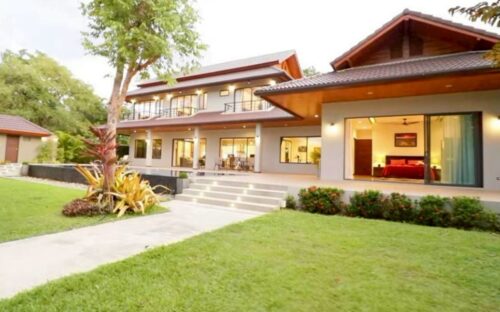A luxurious two-story pool villa for rent in a modern Lanna style, located in Wang Tan Village.