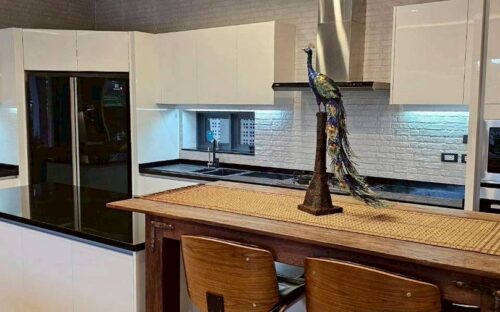 A luxurious two-story pool villa for rent in a modern Lanna style, located in Wang Tan Village.