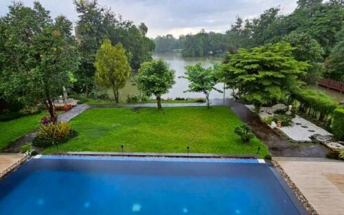 A luxurious two-story pool villa for rent in a modern Lanna style, located in Wang Tan Village.